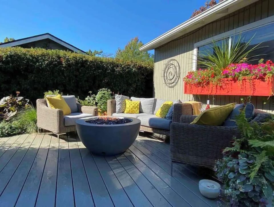 Outdoor shared space with furniture and fire pit.  