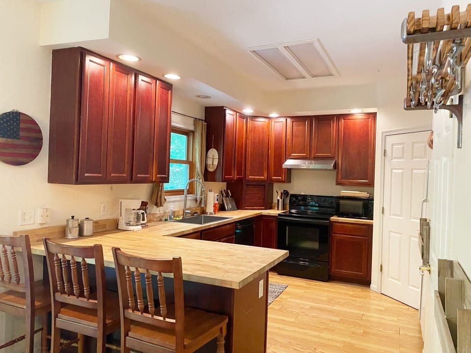 The kitchen has lots of cabinets, a pantry and plenty of countertop space.