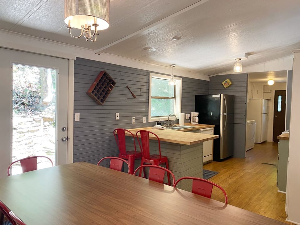 Enjoy views of the woods from the dining room.