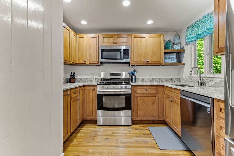 Updated kitchen with stainless steel appliances.