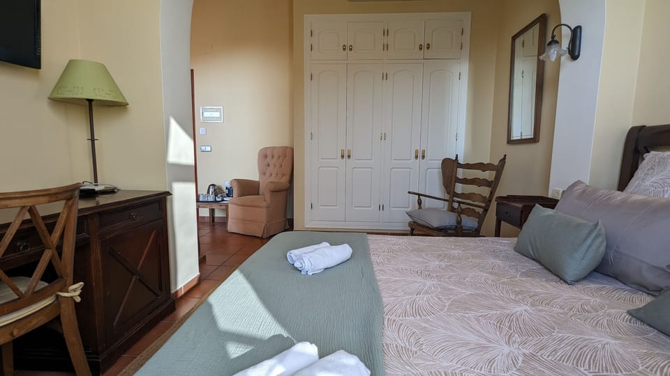 Sink into the cozy bed after a day exploring the area.