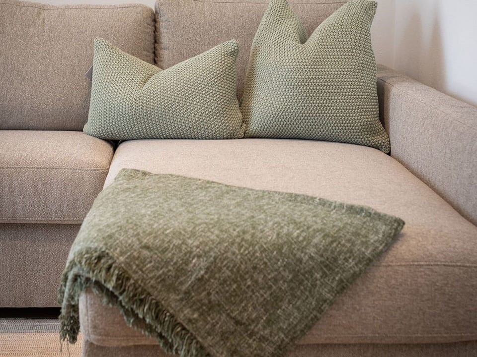 Couch, Furniture, Textile, Cushion, Brown, Living Room, Throw Pillow, Flooring, Floor, Pillow