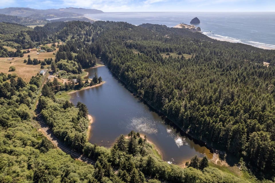 View from above of the private lake and the only two homes on it. Cape Kiwanda can be seen in the background.