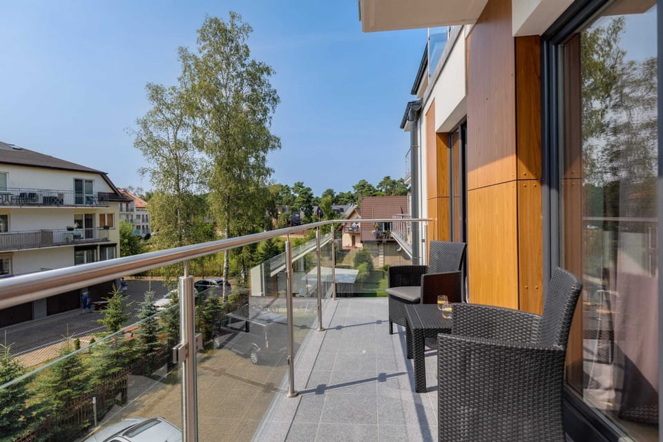 The balcony's stylish design complements the apartment's decor. 