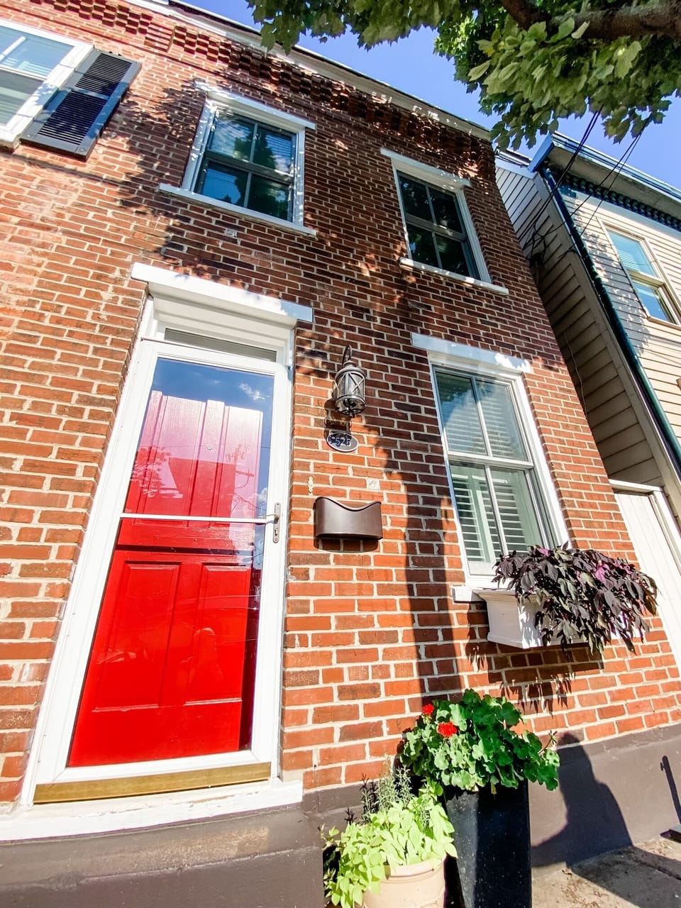Bright red front door welcomes you to your home away from home. 