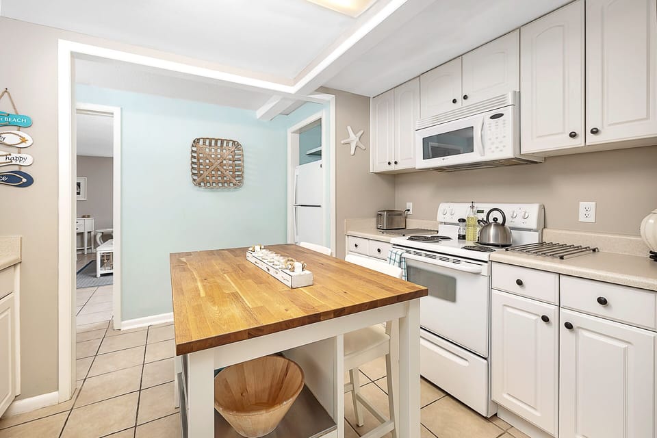 Kitchen with island featuring bar seating for two