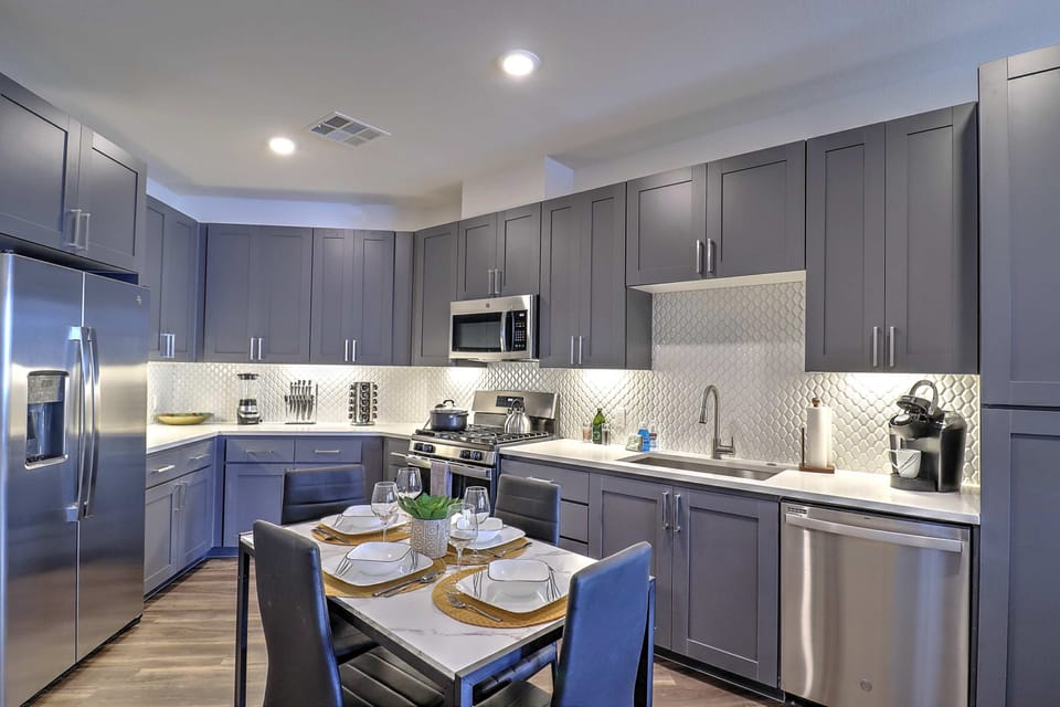 Prepare meals with ease in the fully equipped kitchen stocked with modern appliances and cooking essentials.