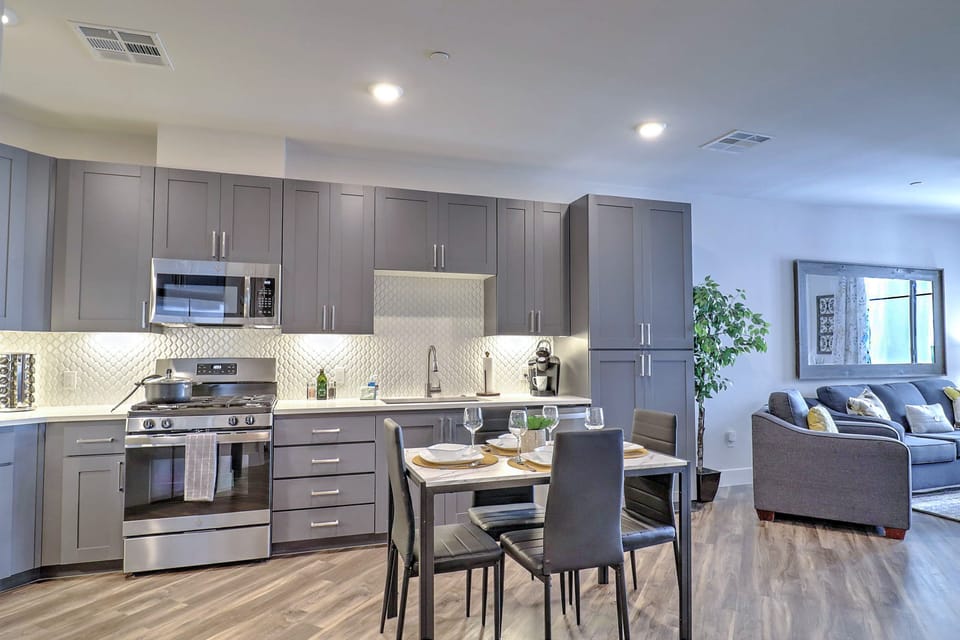 Prepare meals with ease in the fully equipped kitchen stocked with modern appliances and cooking essentials.