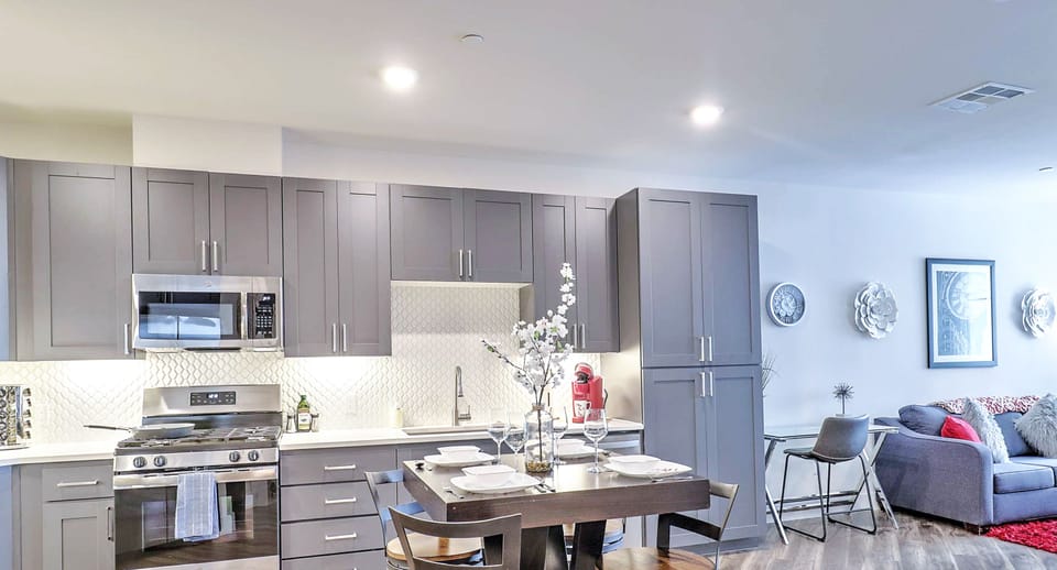Gather around the stylish dining table, ideal for intimate meals or casual conversations.