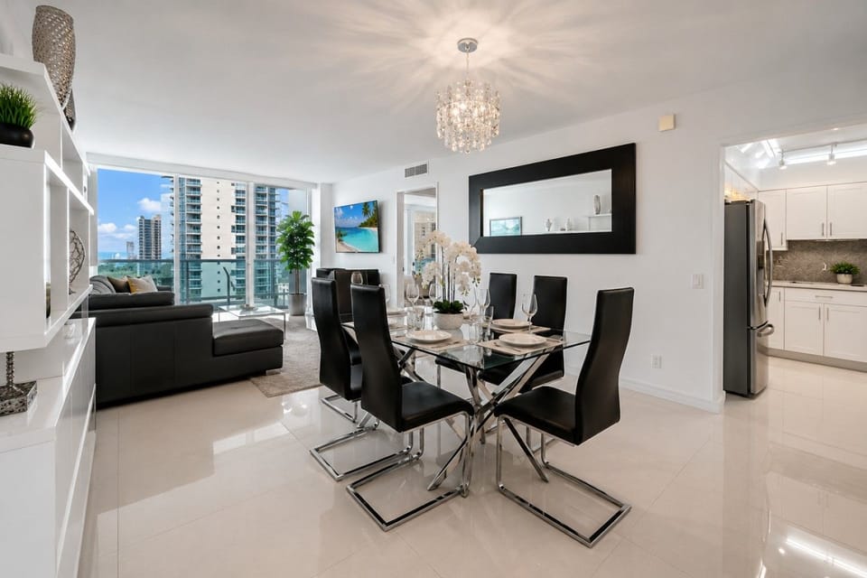 Gather around this sleek and modern dining table, designed to comfortably seat six. Perfect for shared meals, lively conversations, or game nights, this stylish centerpiece adds a touch of elegance to your vacation dining experience.