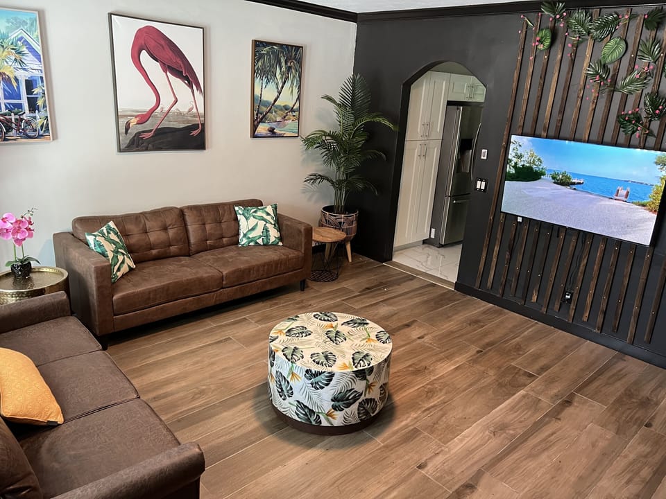 Spacious living room with 55’ smart tv to log into your entertainment apps 