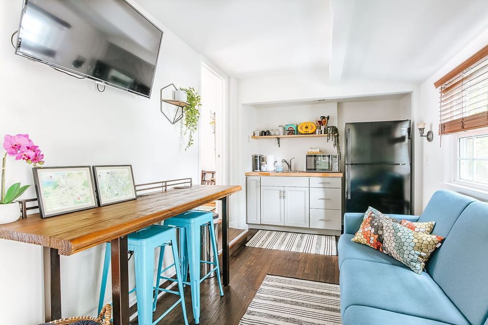 Cozy living space with kitchenette and work table