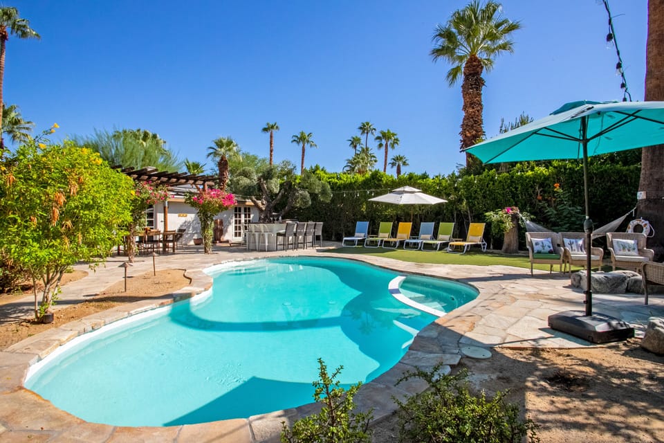 Saltwater pool, loungers, fire pit, hammock, outdoor bar + grill, and more!