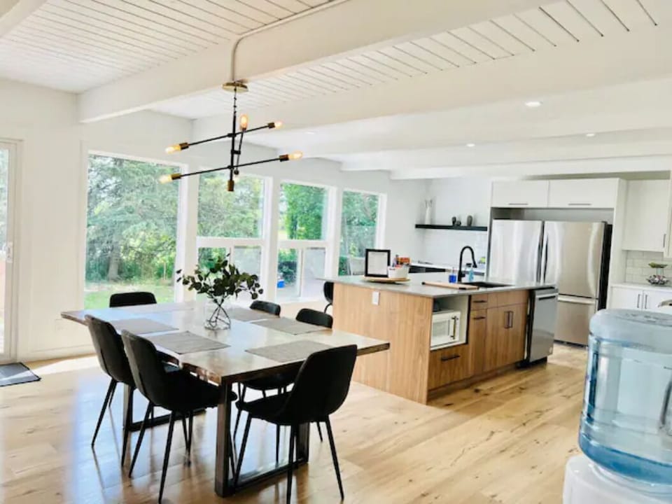 Dining table & kitchen with plenty of natural light
