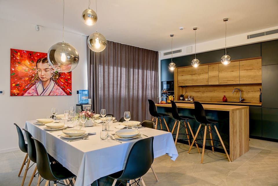 Fully equipped modern kitchen next to the dinning area for 8 persons.