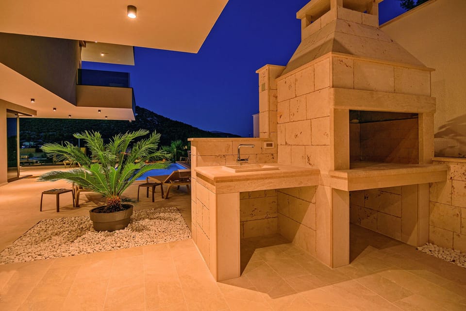Night view of the villa and pool side
