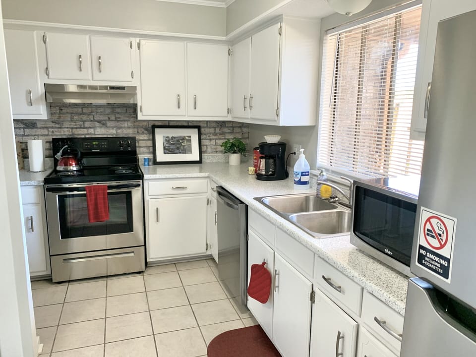 The kitchen has all amenities you'll need during your stay.