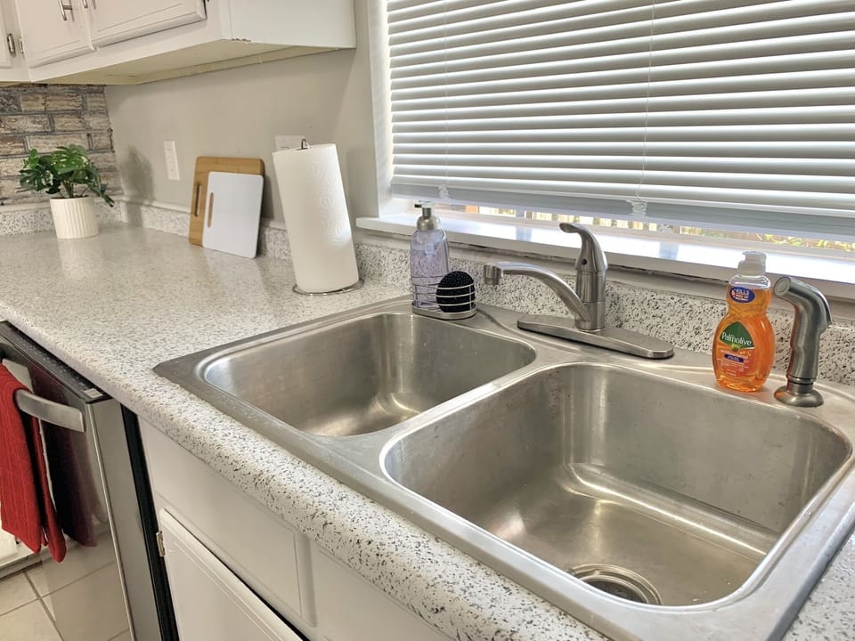 The kitchen has all amenities you'll need during your stay.
