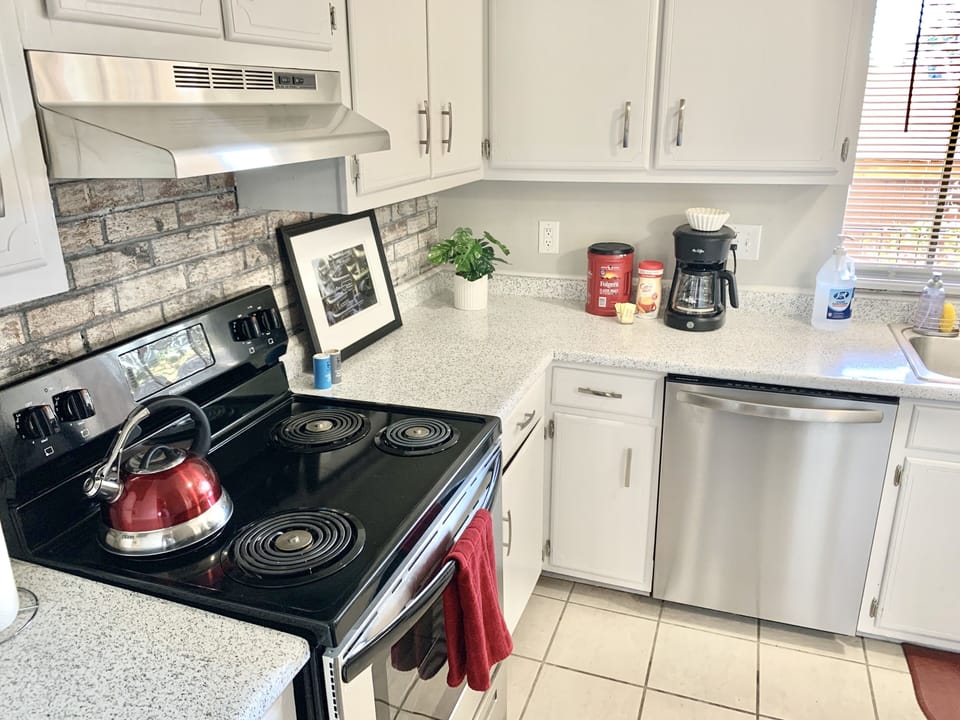 The kitchen has all amenities you'll need during your stay.