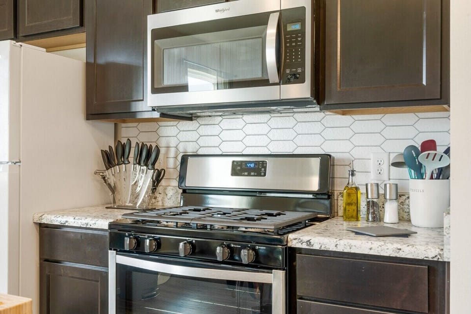 Kitchen - Ceramic pots & pans, Full chef knife set,  premium silicone cooking utensils, wine glasses, plates and bowls for up to 8. 