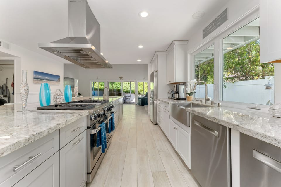 Gourmet Kitchen with 2 dishwashers, 2 ovens, 2 sinks, 2 ovens, and 2 garbage dis