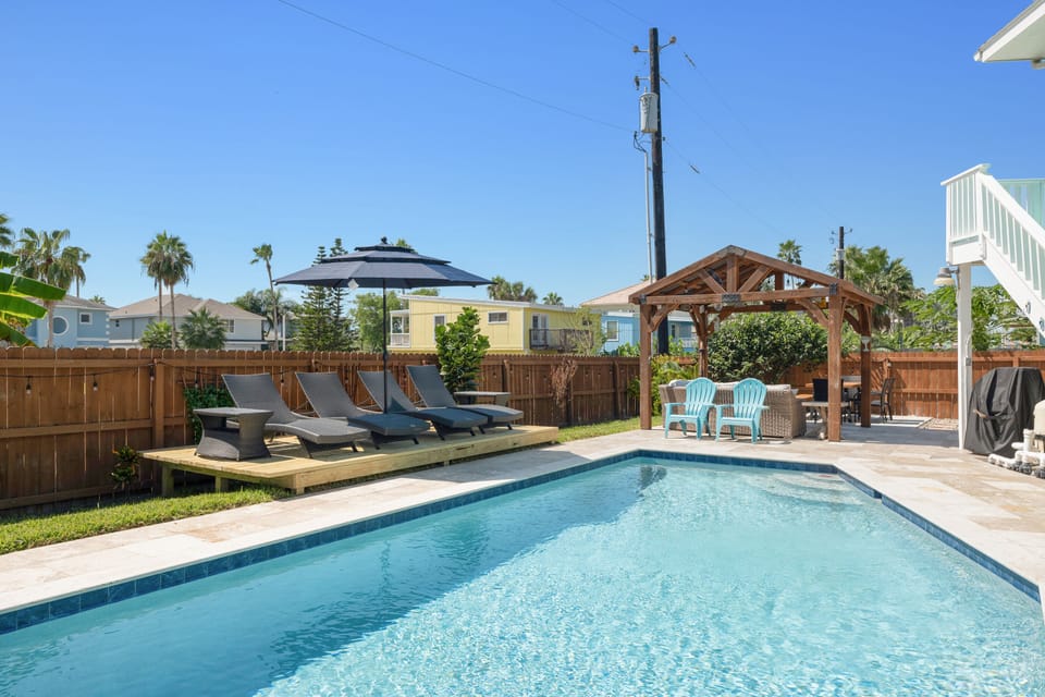 Large heated pool, lounge chairs, gazebo, dinning area, firepit
