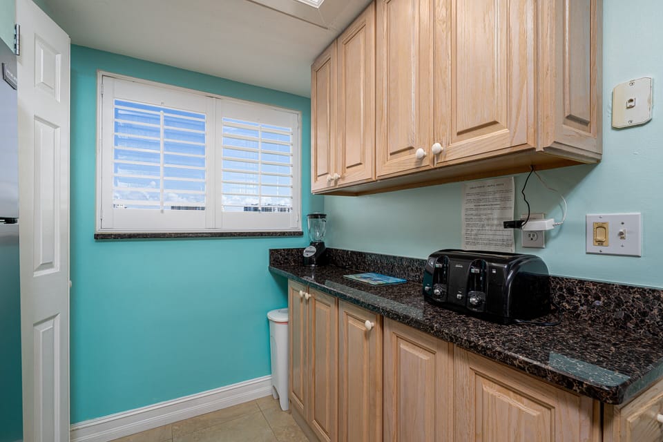 Stacked Washer/Dryer in corner closet in Kitchen