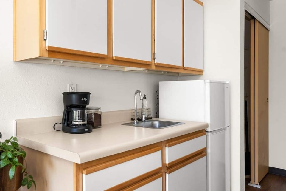 Kitchenette with coffee maker, microwave, and mini-fridge. Perfect for a quick breakfast to enjoy on the porch!