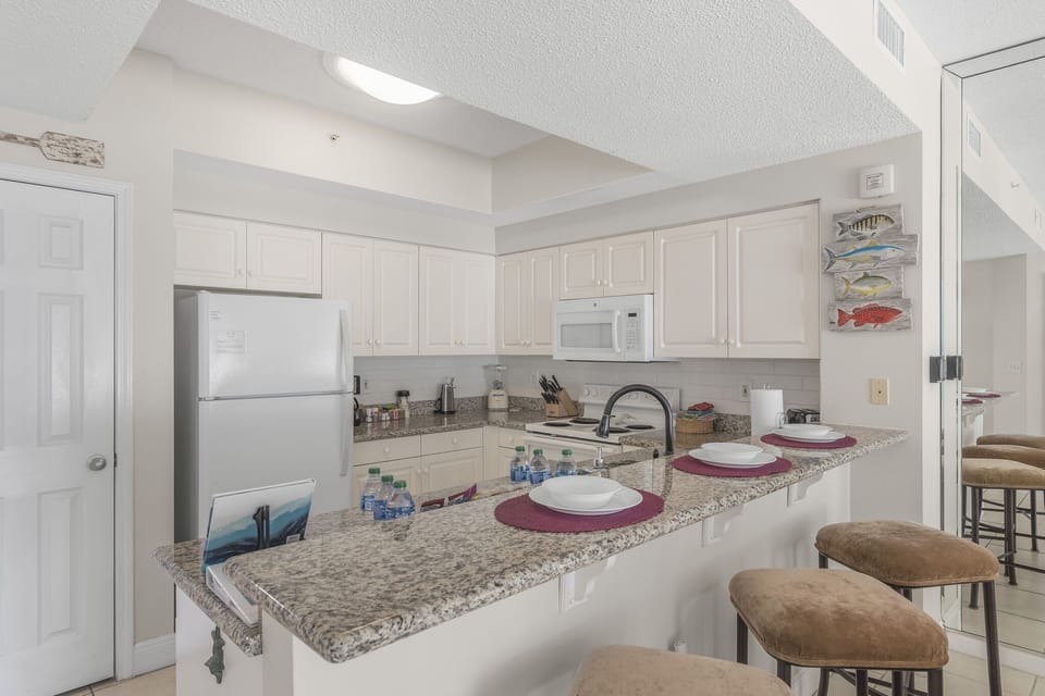 The updated kitchen has granite countertops and is fully stocked with more than the basics (coffee/tea bar, oils/spices, Tupperware, plenty of pots/pans/cookware) so you and your group can pre