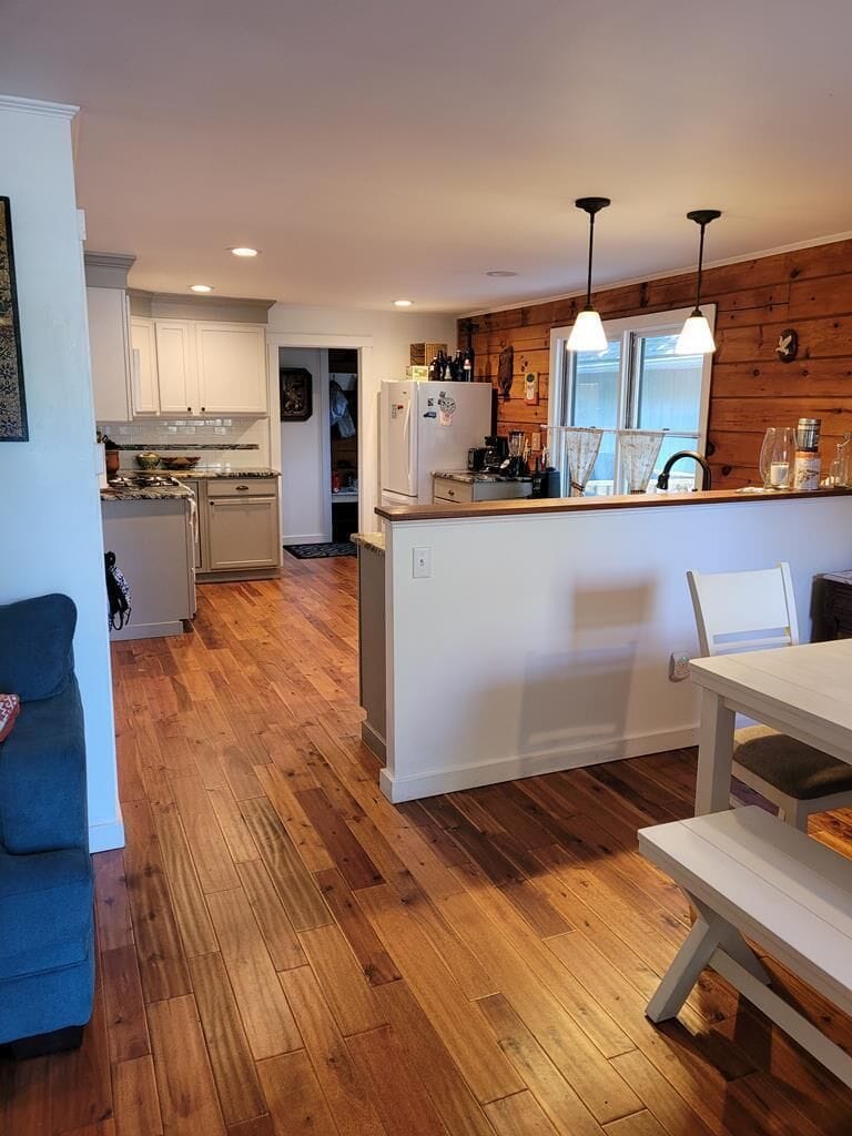 Kitchen looking from front door. Fridge with ice maker