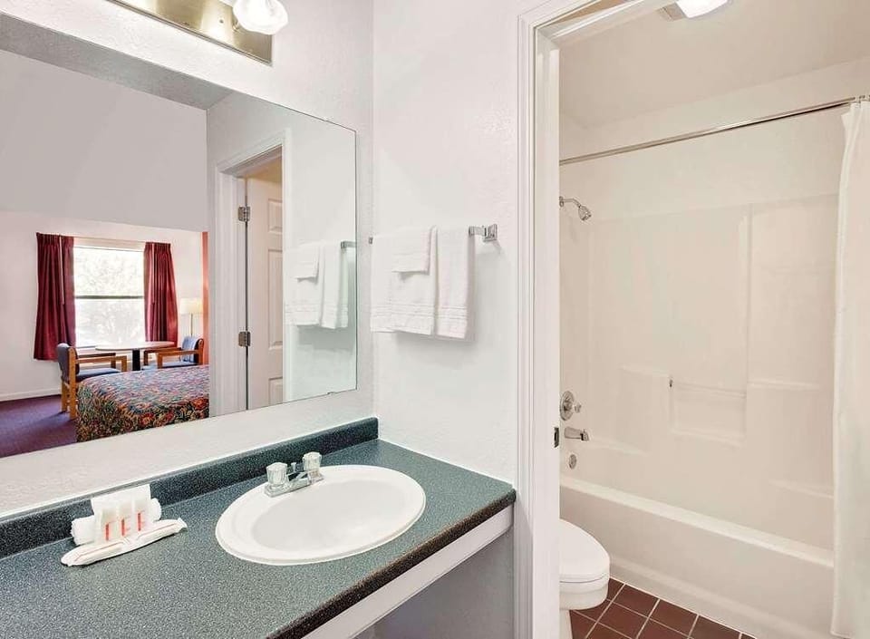 Refresh each morning with a clean vanity and bright bath area.