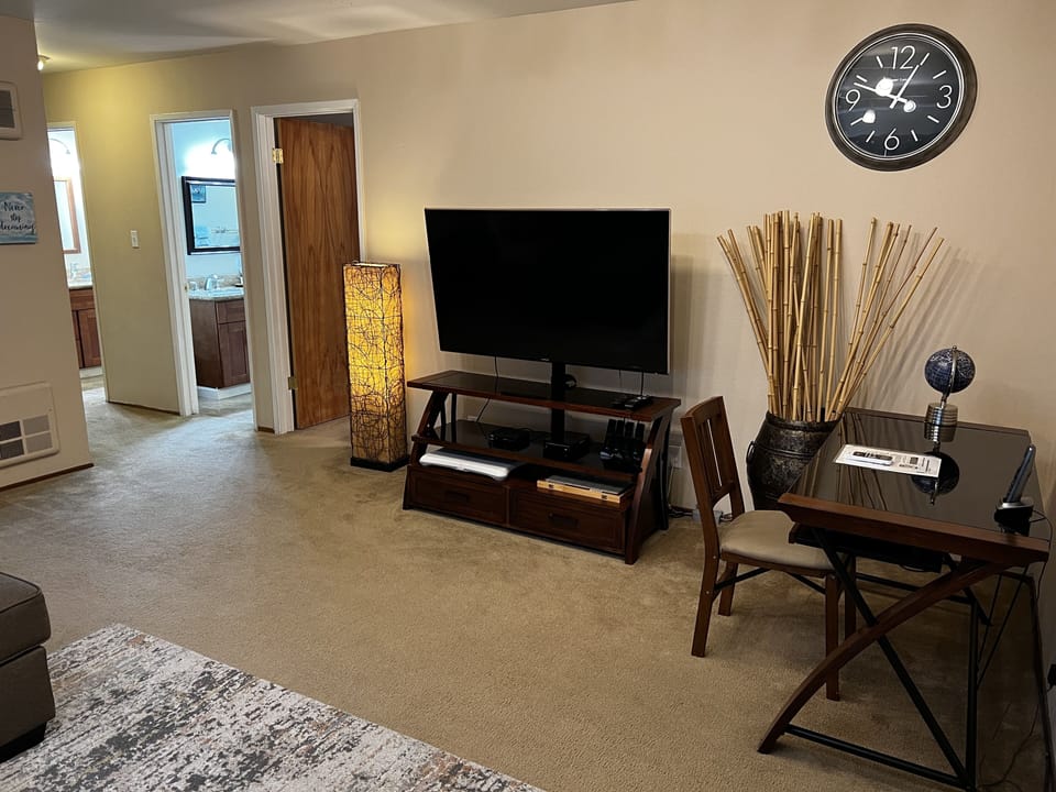 Living Room - LCD TV, desk w/chair, large sofa, AC/heater unit