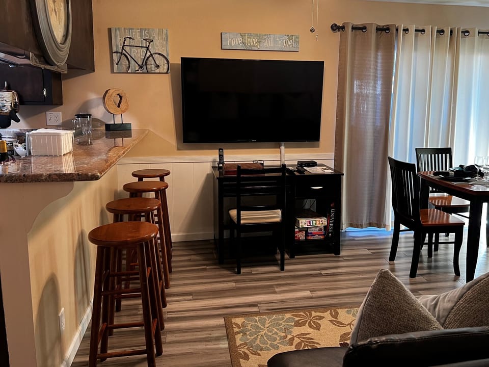 Family/Dining Room - dining table, desk w/chair, LCD TV, dining counter for 4