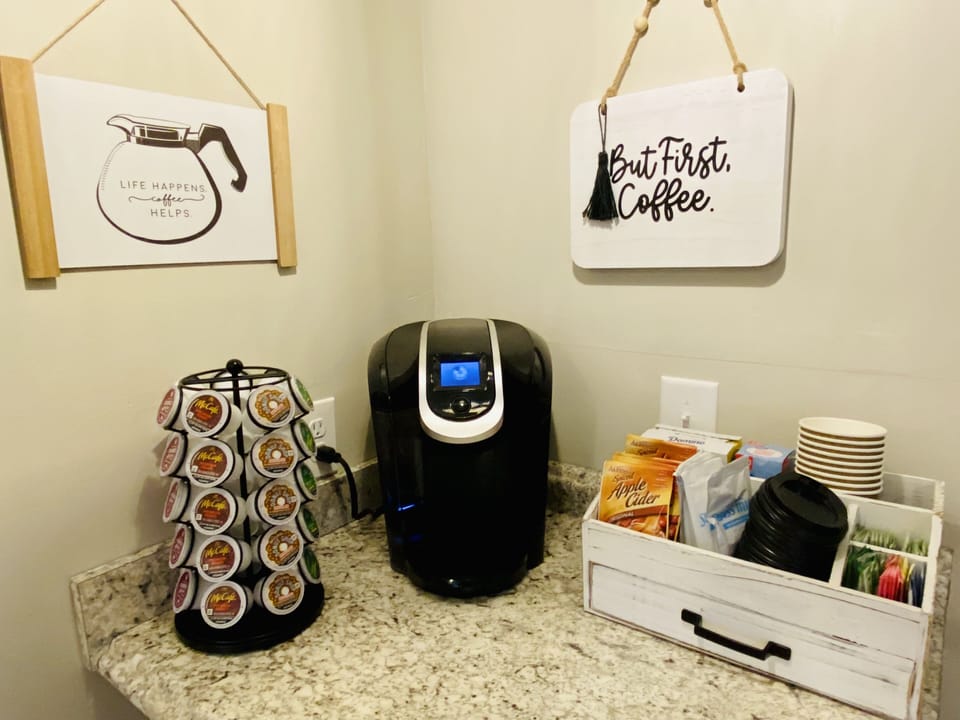 Stocked coffee bar, sweeteners, cider, cocoa, & to-go cups.  (also drip machine)