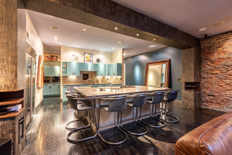 Chef’s Dream – Sub-Zero fridge, 6-burner gas stove, double Viking ovens & more.