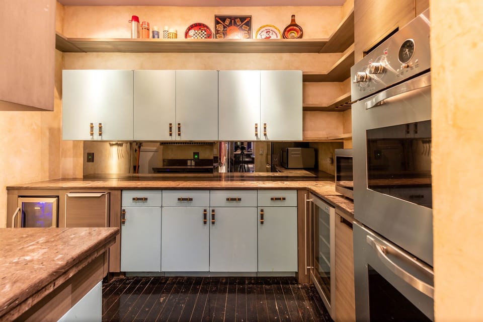 Chef’s Extension – Pantry with premium features including Viking double ovens and an ice maker.