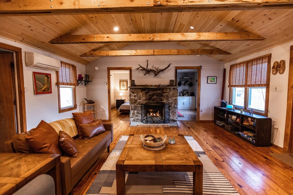 Fireplace is carved from local stone is a masterpiece of the living room