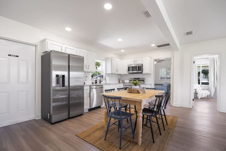 Open kitchen and dining with new appliances, fully stocked cookware, and a K-Cup Keurig—everything you need to cook and enjoy meals together.