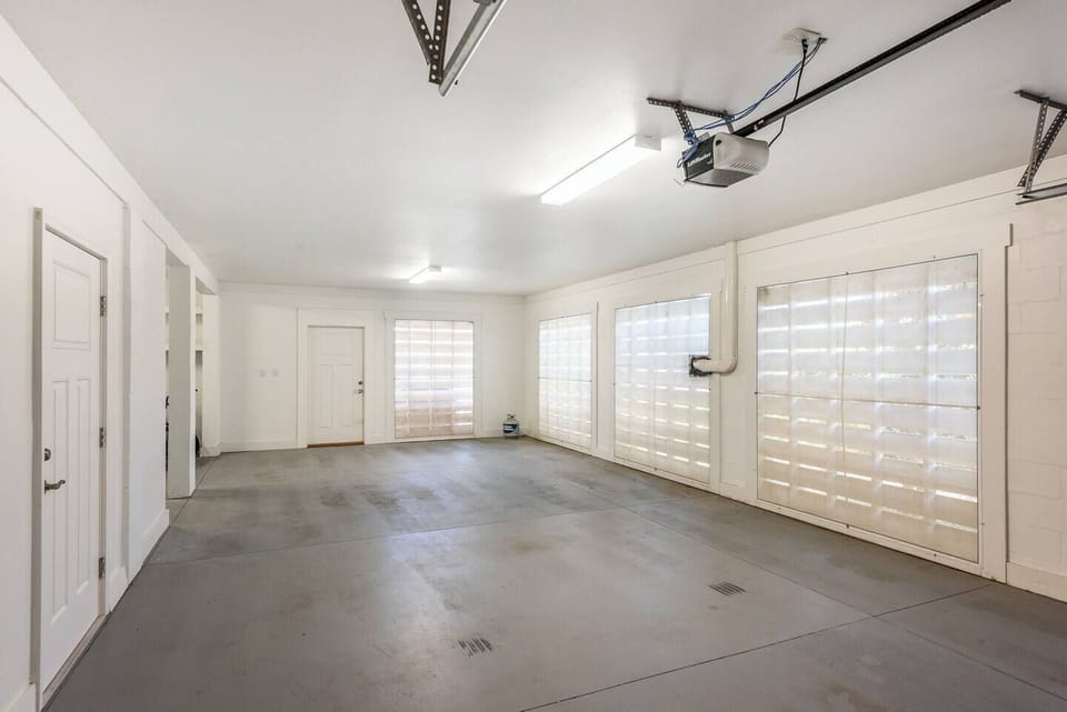 Large garage fits 2 cars plus a golf cart