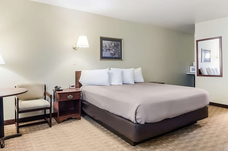 Unwind into a plush king bed after a busy day.