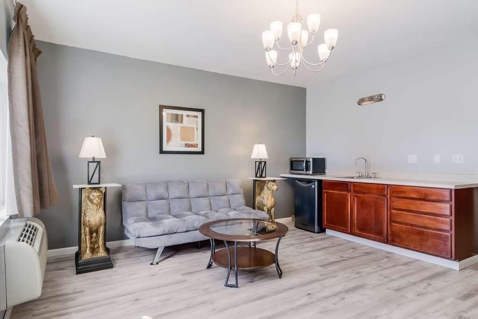 Settle in with a cozy sofa and convenient in-room kitchenette.
