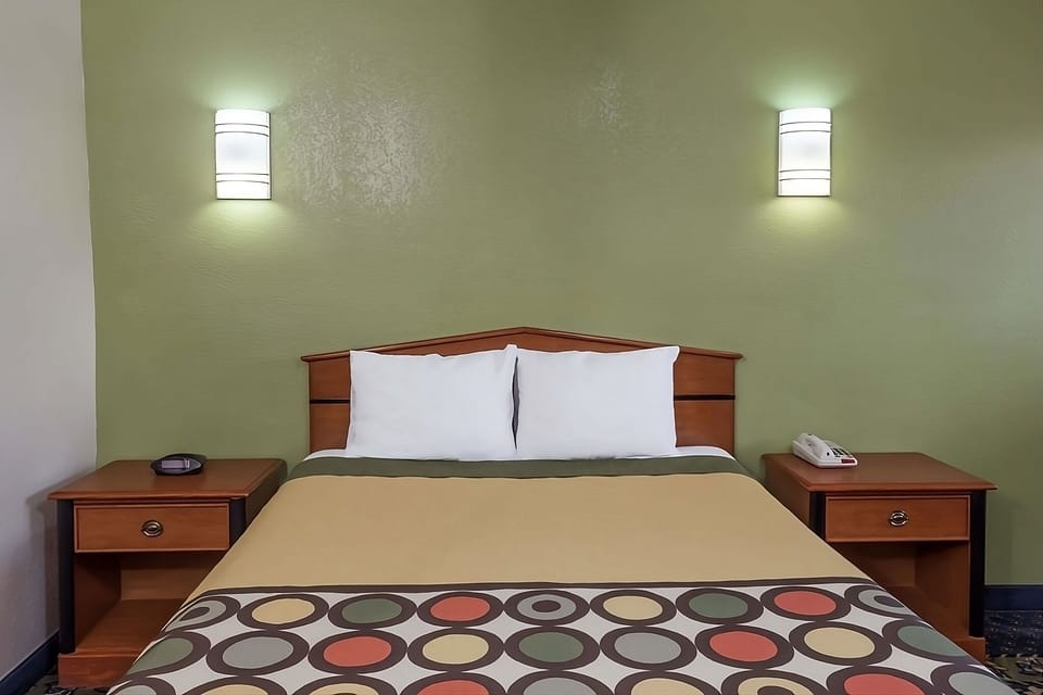 Drift off quickly on a neatly made, inviting bed.