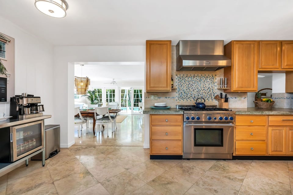 Create a "Masterchef" meal in the fully-equipped kitchen with a commercial-grade gas-range stove and plenty of counter space. Grab a coffee from the coffee bar, which sits to the entrance to the dining room.