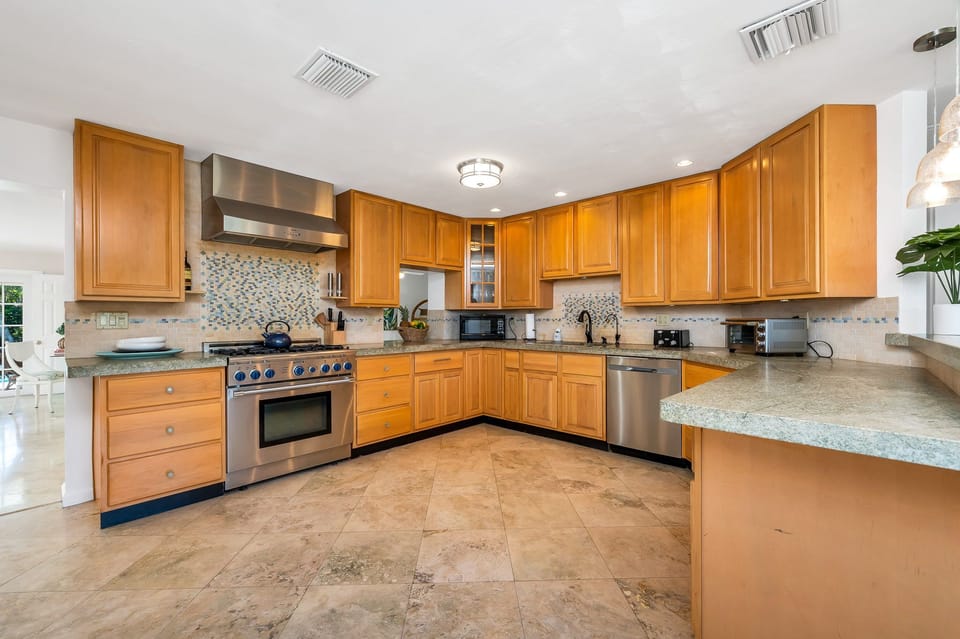 Create a "Masterchef" meal in the fully-equipped kitchen with a commercial-grade gas-range stove and plenty of counter space. Grab a coffee from the coffee bar, which sits at the entrance to the dining room.