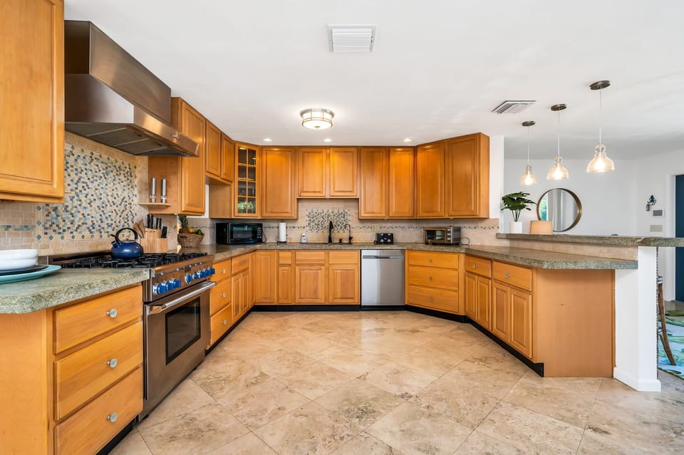 Create a "Masterchef" meal in the fully-equipped kitchen with a commercial-grade gas-range stove and plenty of counter space. Grab a coffee from the coffee bar, which sits at the entrance to the dining room.