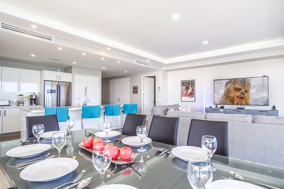 Dine at the opulent glass dining table for six.