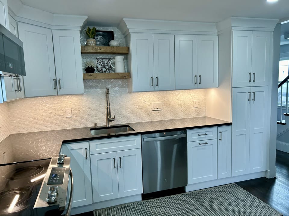 Stunning kitchen. Gorgeous backsplash and under lighting. 