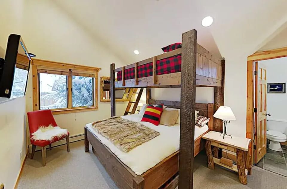 Bunk Bed with Queen bed on top of King bed and a twin trundle below King bed.
