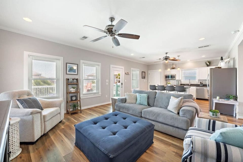 The open concept plan boasts a large family room that has amazing natural light and plenty of comfy seating.