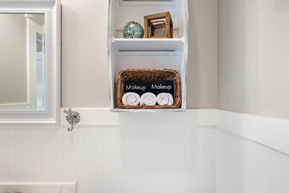 Shampoo, conditioner, soap, plush white towels, black makeup towels and hair dryer provided!
